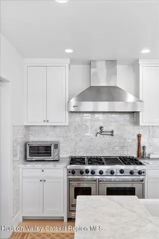 a bathroom with a bathtub and a sink