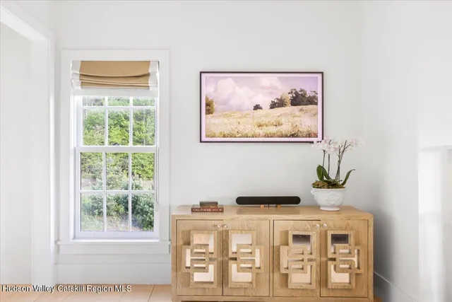 a bathroom with a toilet a sink and a mirror