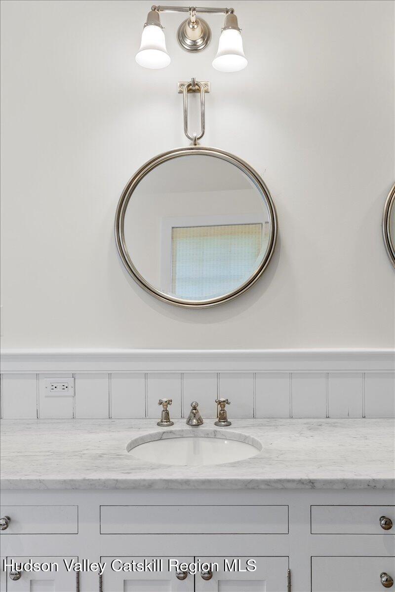 150 Harrington Drive Austerlitz, NY 12017 - Photo 34 of 82 a bathroom with a sink and a mirror