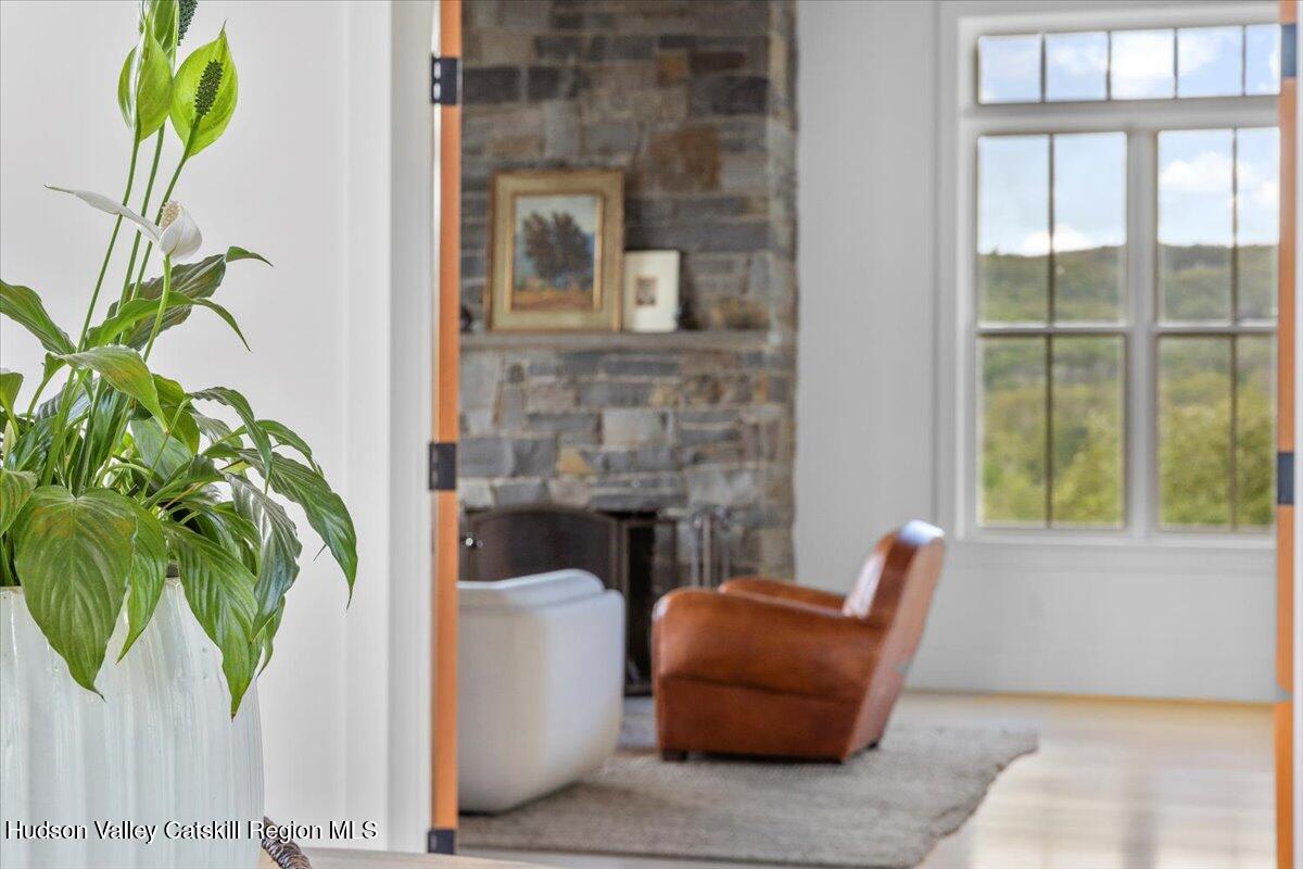 150 Harrington Drive Austerlitz, NY 12017 - Photo 4 of 82 a living room with furniture and a potted plant