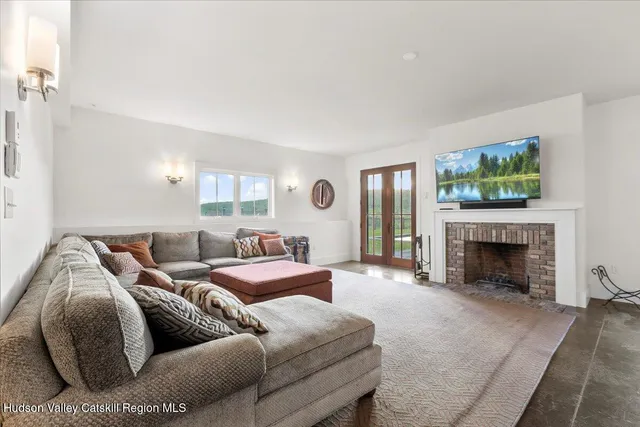 a view of a yard with plants and large trees