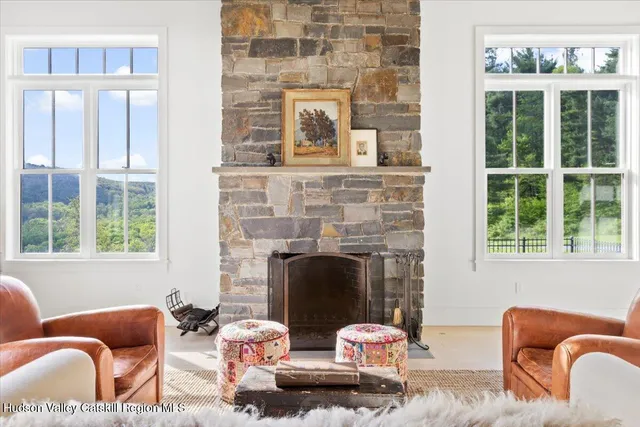 a kitchen with stainless steel appliances granite countertop a sink a stove and a wooden cabinets