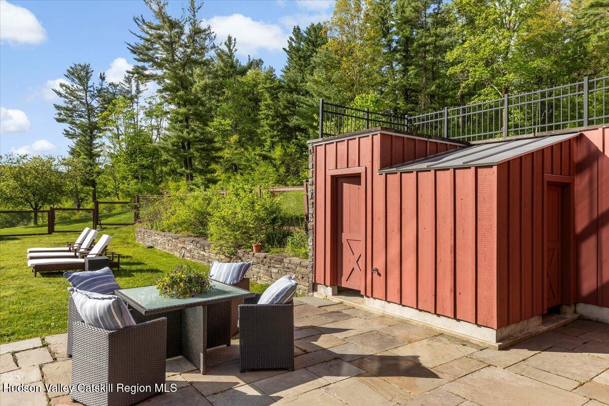 150 Harrington Drive Austerlitz, NY 12017 - Photo 61 of 82 a view of a patio with a table and chairs