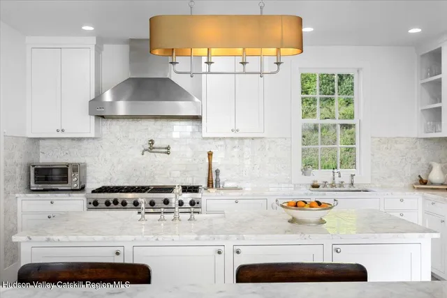 a living room with furniture and large window