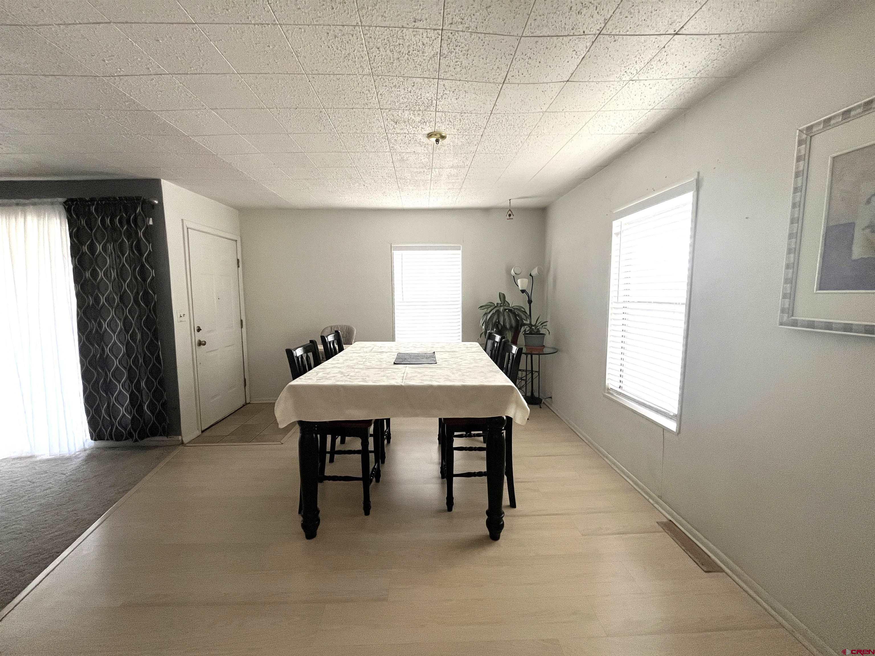 204 South Chestnut Street Cortez, CO 81321 - Photo 16 of 32 a dining room with a table and chairs