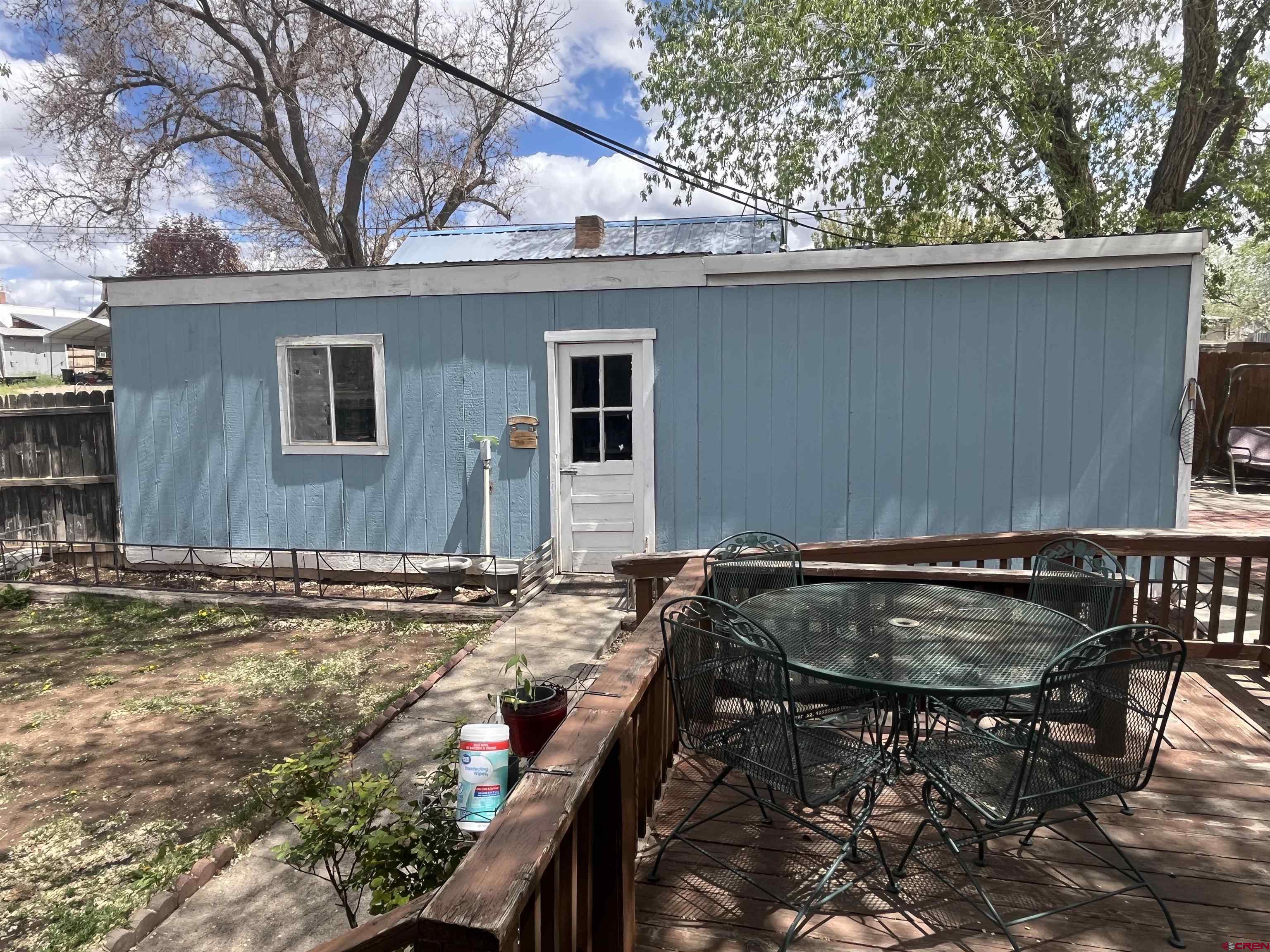 204 South Chestnut Street Cortez, CO 81321 - Photo 25 of 32 a backyard of a house with table and chairs