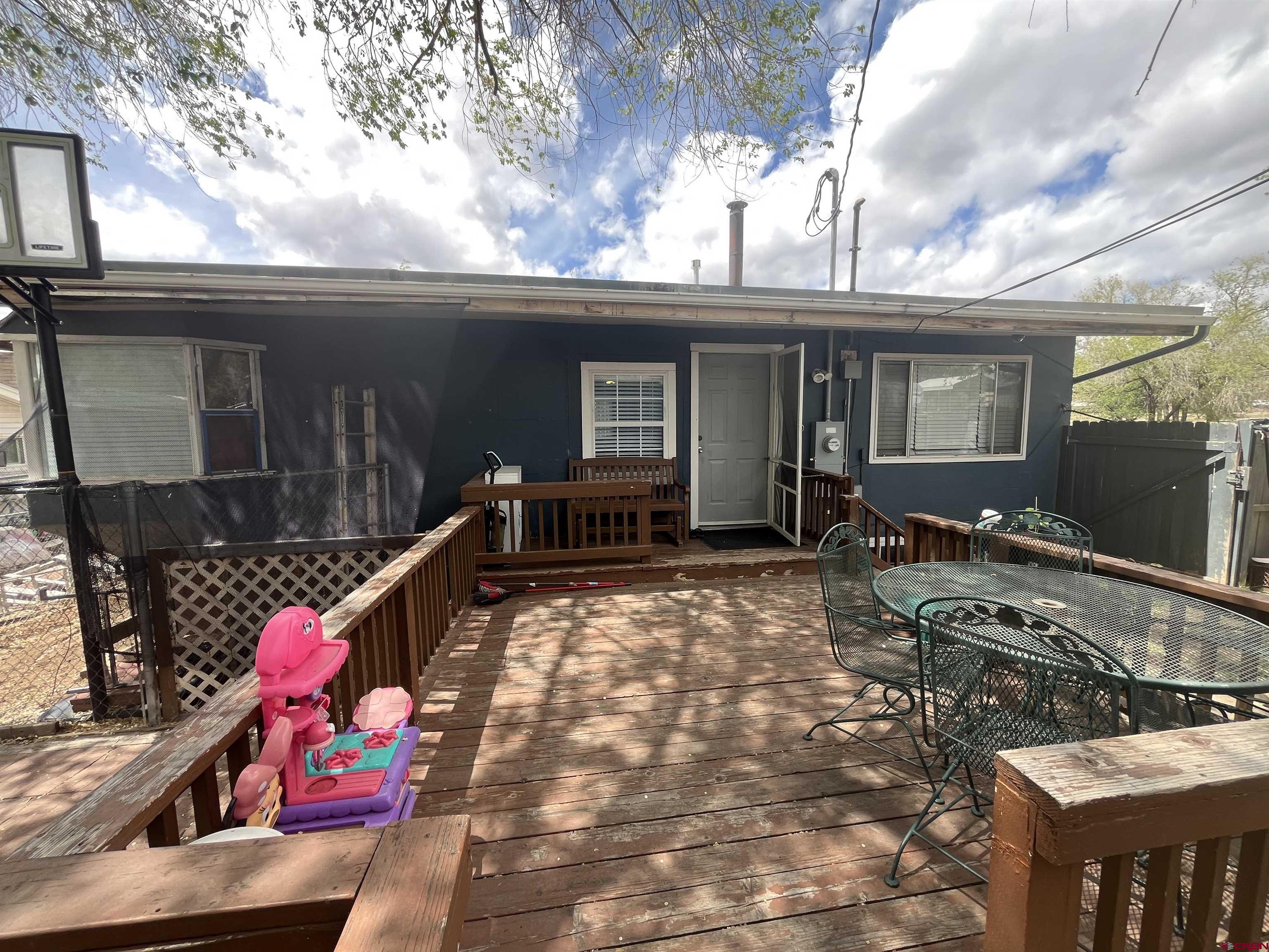 204 South Chestnut Street Cortez, CO 81321 - Photo 27 of 32 a backyard of a house with seating space