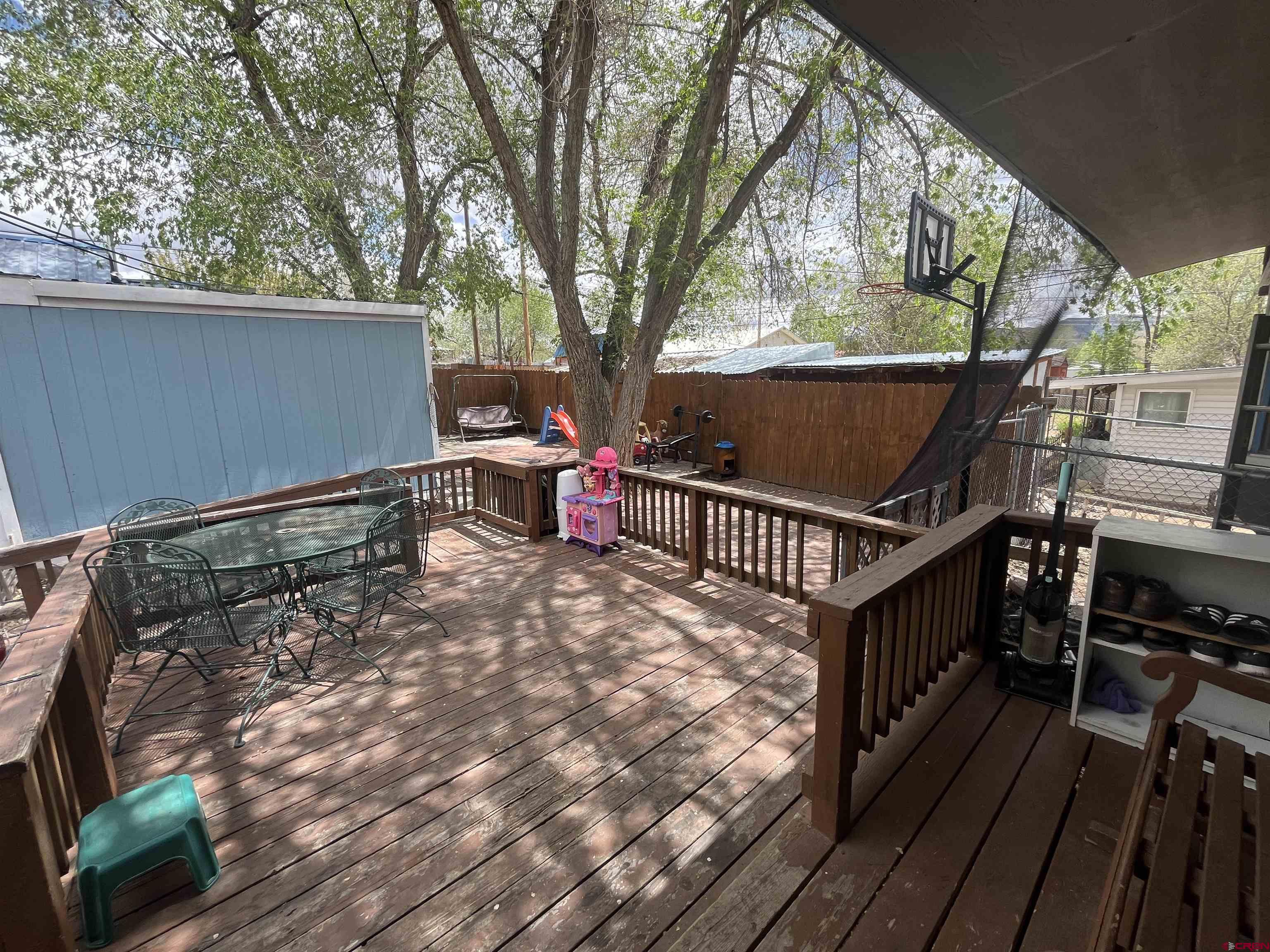204 South Chestnut Street Cortez, CO 81321 - Photo 30 of 32 a view of deck with wooden floor and outdoor seating