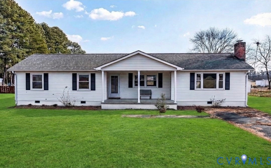 a front view of a house with a yard and porch
