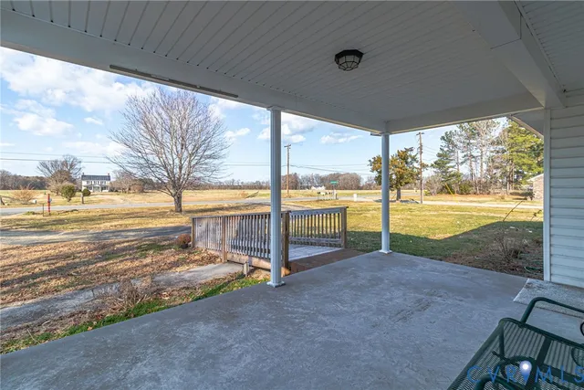 a view of a roof deck with wooden floor and fence