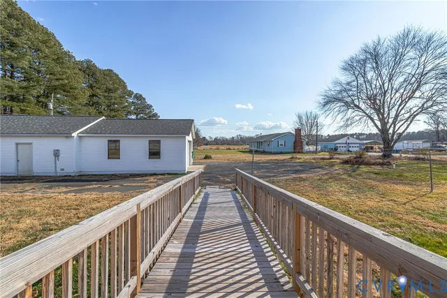 a view of a house with wooden fence