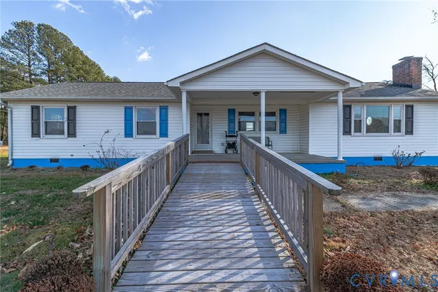 a pathway of a house with a yard