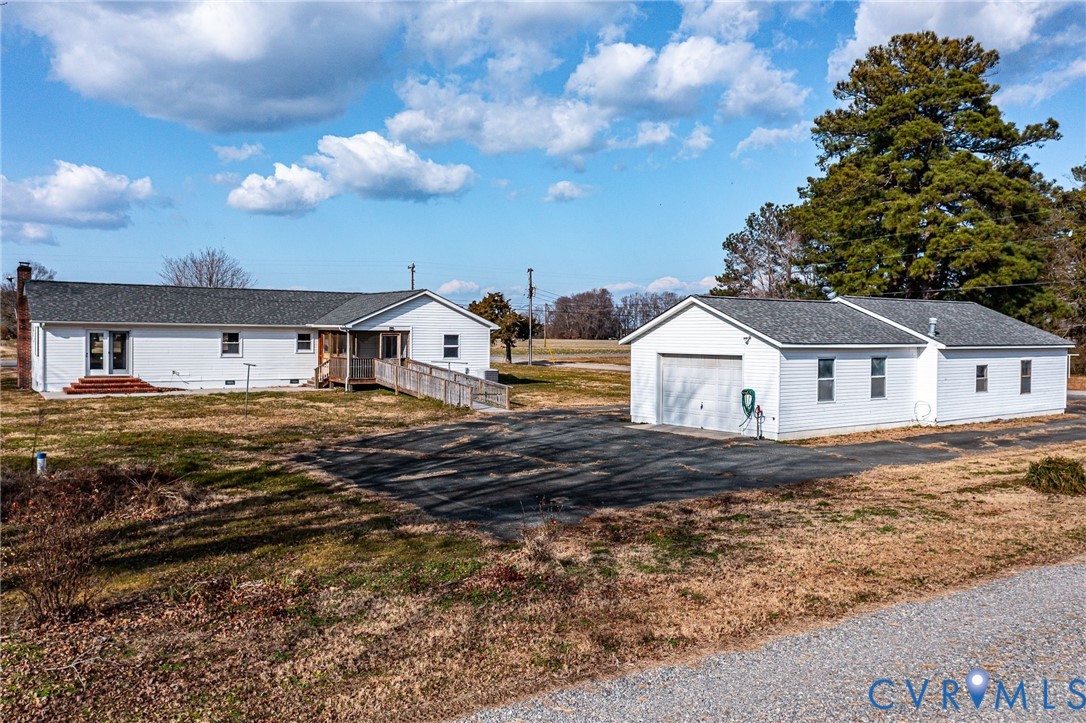 1928 Lake Road Lottsburg, VA 22511 - Photo 32 of 47 a house view with a garden