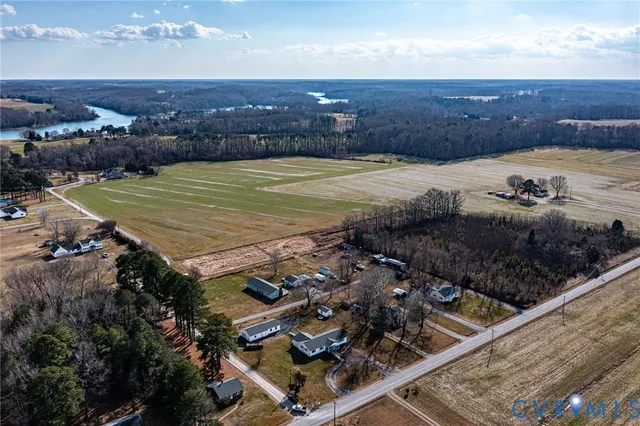 an aerial view of a house with lake view