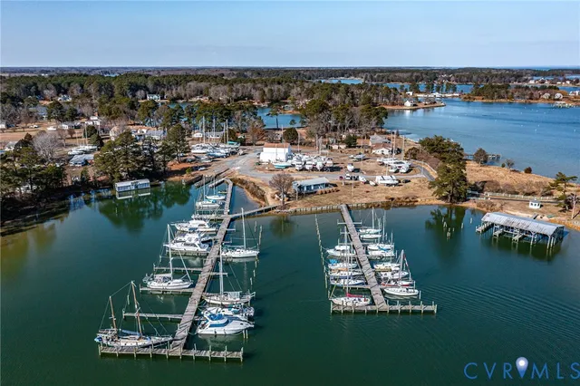 an aerial view of a house with a lake view