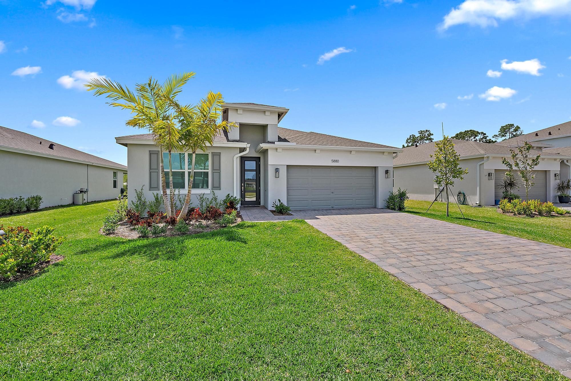 5880 Southeast Sky Blue Circle Stuart, FL 34997 - Photo 1 of 48 Exterior-Paver Driveway