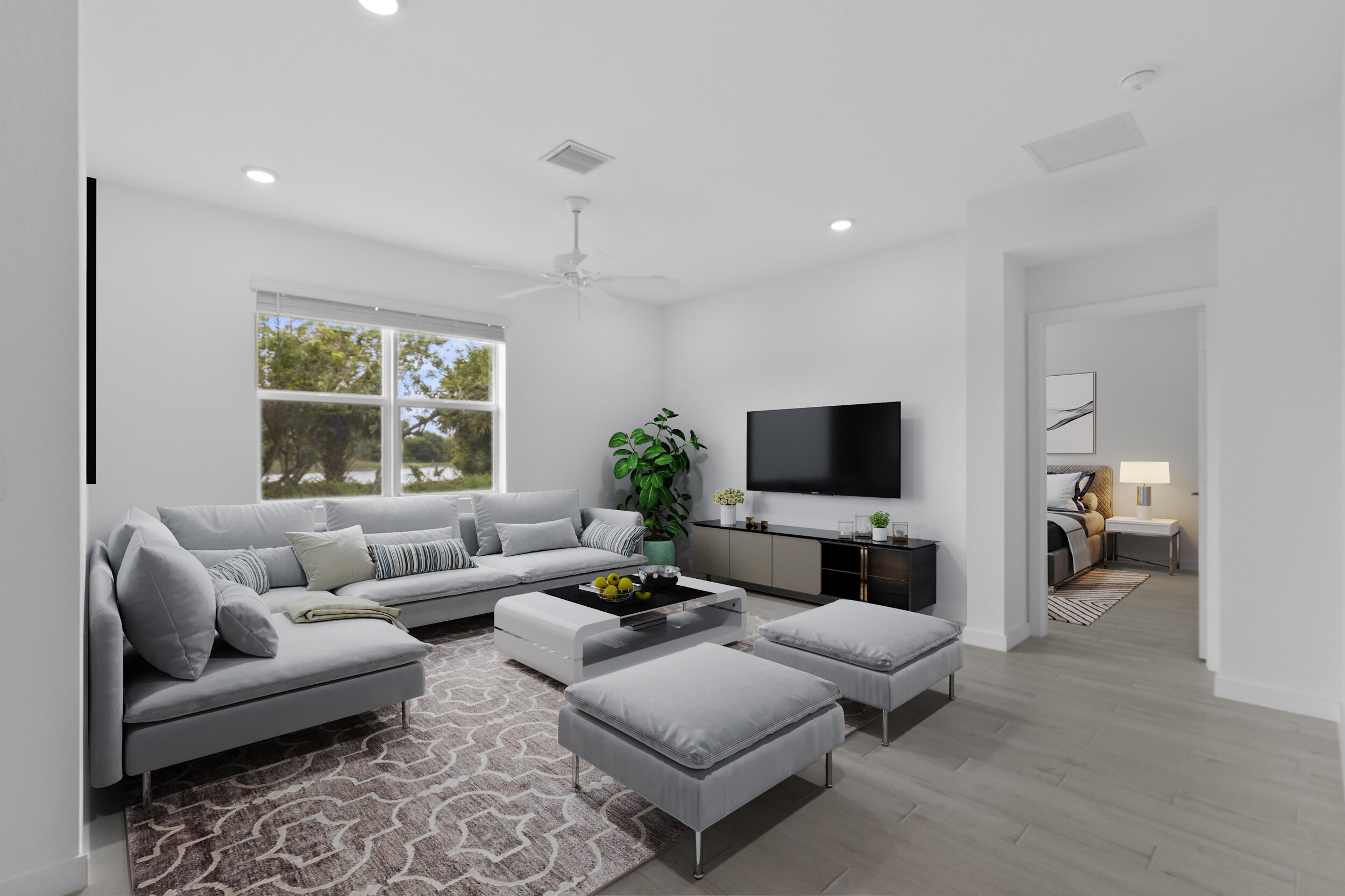 5880 Southeast Sky Blue Circle Stuart, FL 34997 - Photo 11 of 48 a living room with furniture and a flat screen tv