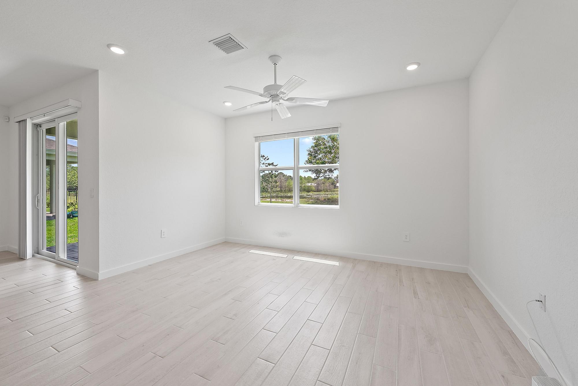 5880 Southeast Sky Blue Circle Stuart, FL 34997 - Photo 12 of 48 Living/Family Room w/View of Lake