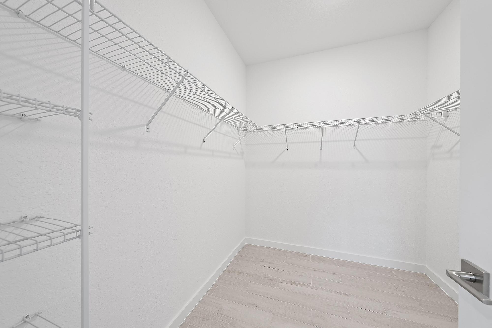 5880 Southeast Sky Blue Circle Stuart, FL 34997 - Photo 20 of 48 a view of a room with racks on the wall
