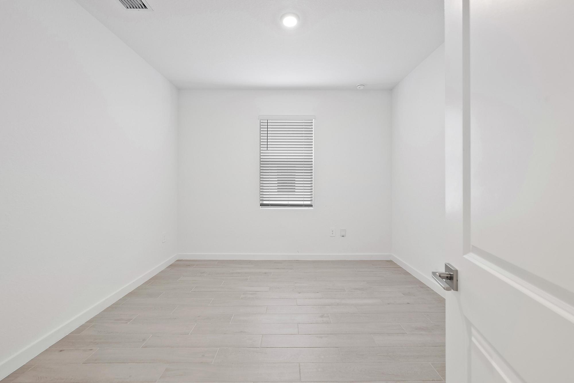 5880 Southeast Sky Blue Circle Stuart, FL 34997 - Photo 25 of 48 an empty room with a window