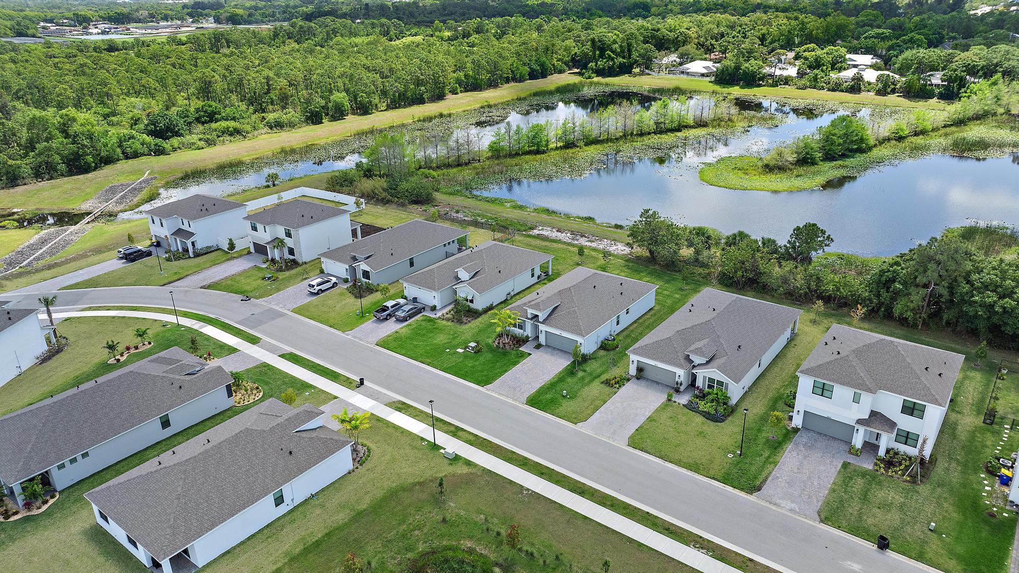 5880 Southeast Sky Blue Circle Stuart, FL 34997 - Photo 36 of 48 an aerial view of a house with a garden