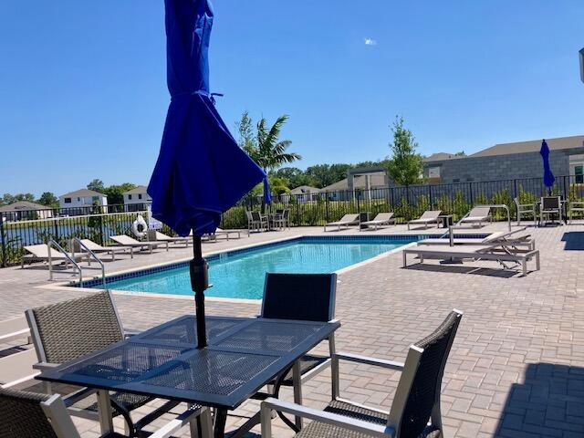 5880 Southeast Sky Blue Circle Stuart, FL 34997 - Photo 43 of 48 a view of outdoor space with seating area