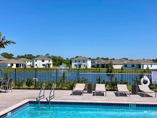 5880 Southeast Sky Blue Circle Stuart, FL 34997 - Photo 44 of 48 a view of a chairs and table on the terrace