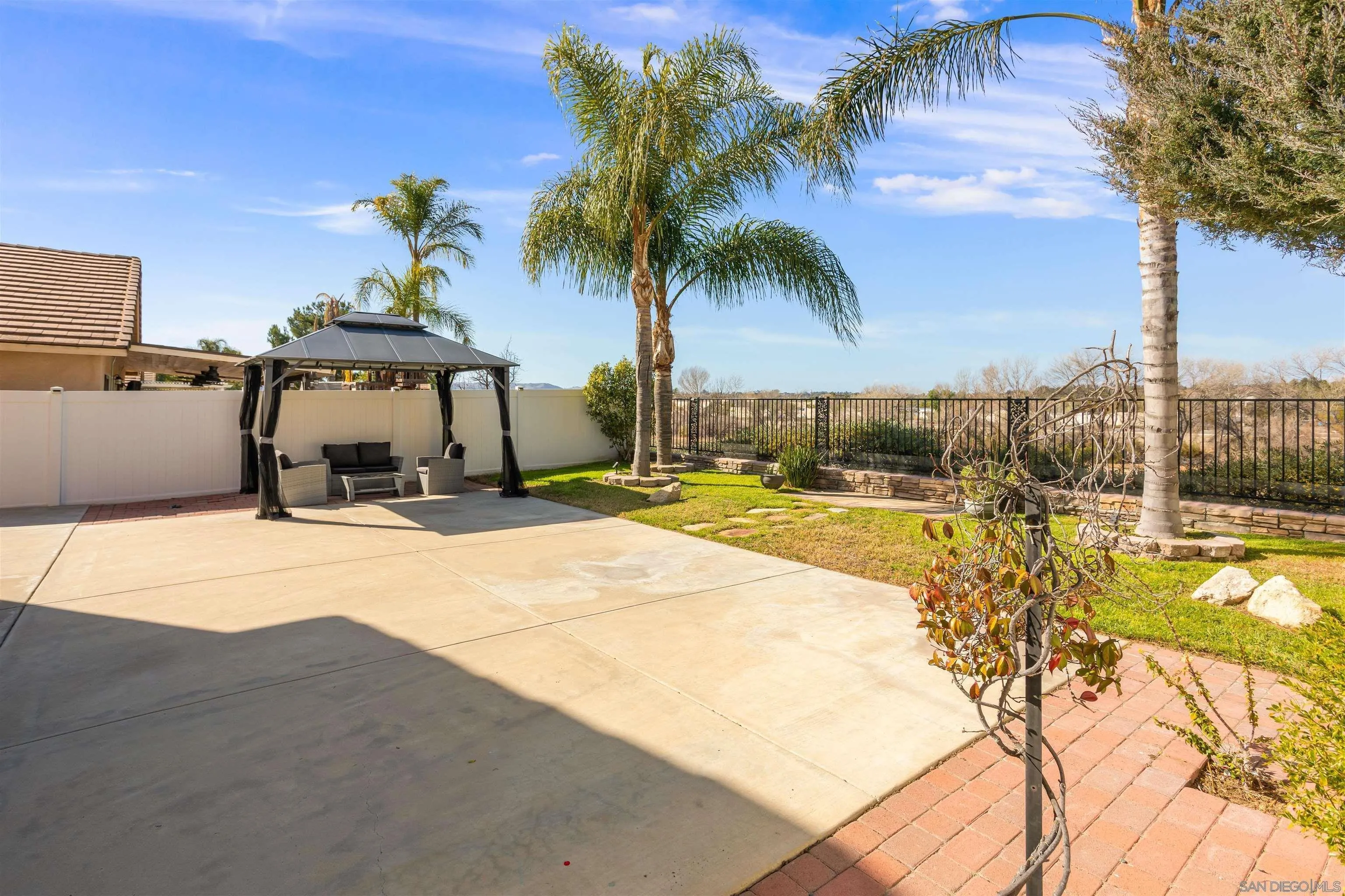 32812 Tulley Ranch Road Temecula, CA 92592 - Photo 19 of 27 a house with a yard and palm trees
