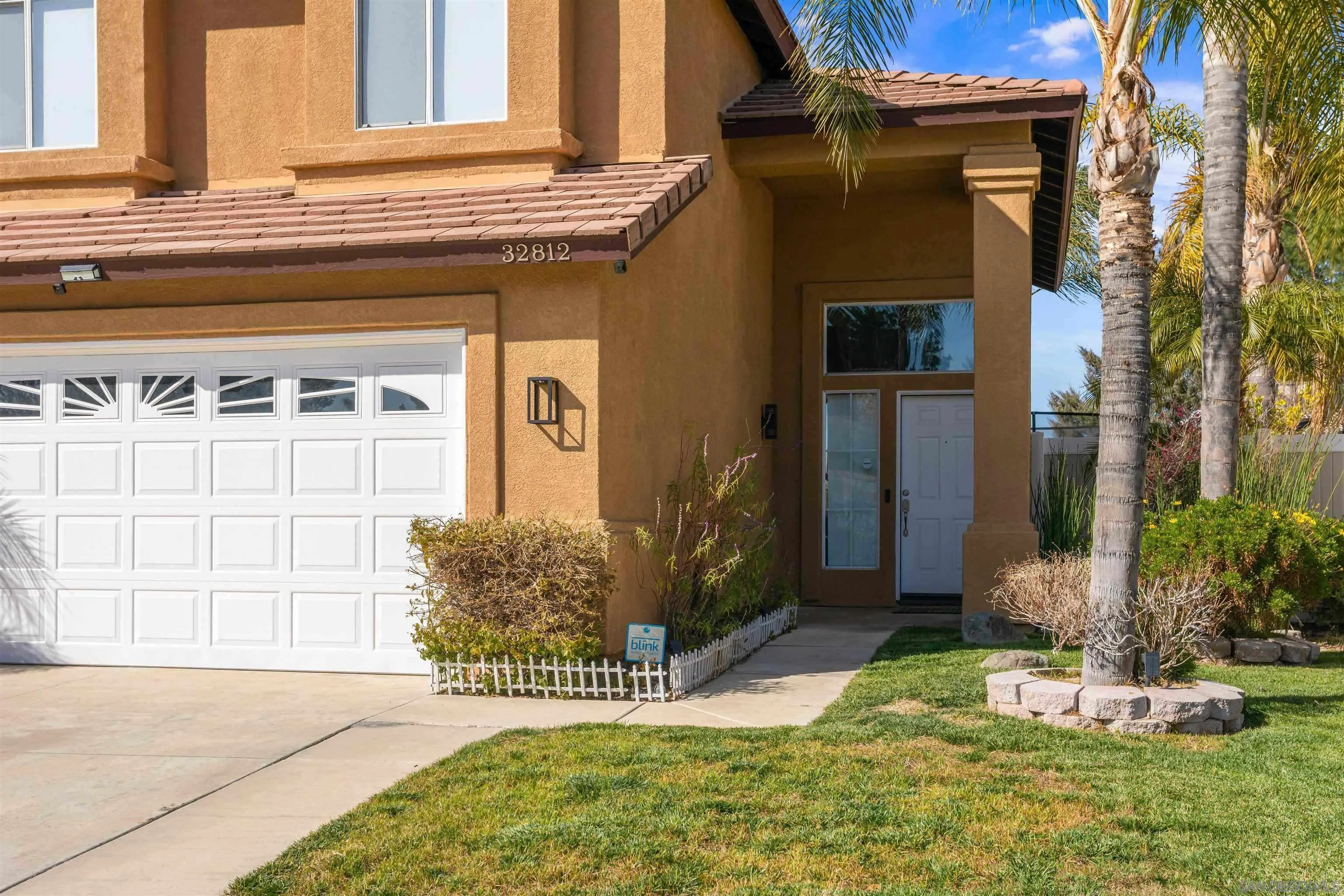 32812 Tulley Ranch Road Temecula, CA 92592 - Photo 2 of 27 a front view of a house with a yard