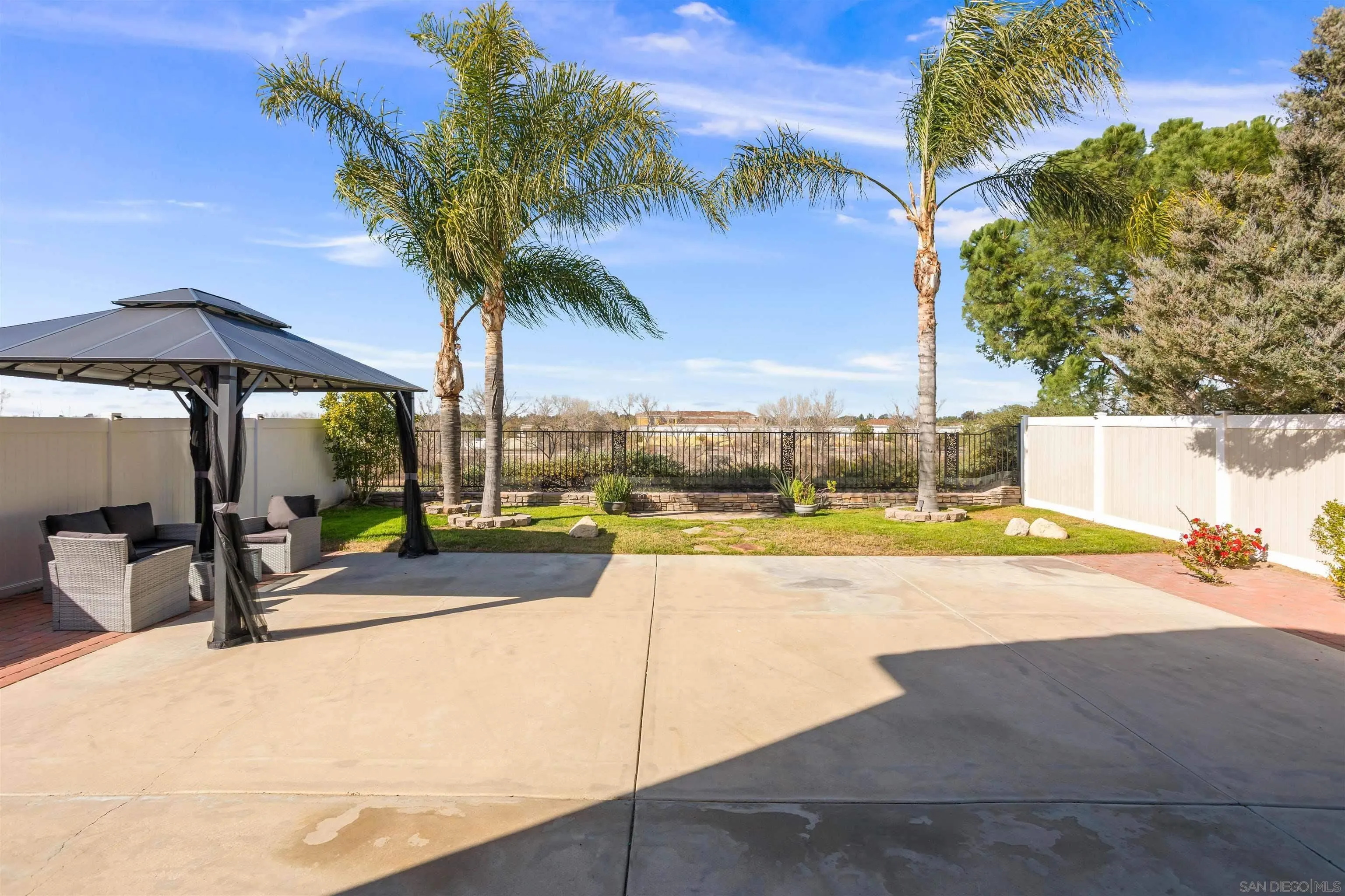 32812 Tulley Ranch Road Temecula, CA 92592 - Photo 21 of 27 a view of a swimming pool with a lounge chair and palm trees