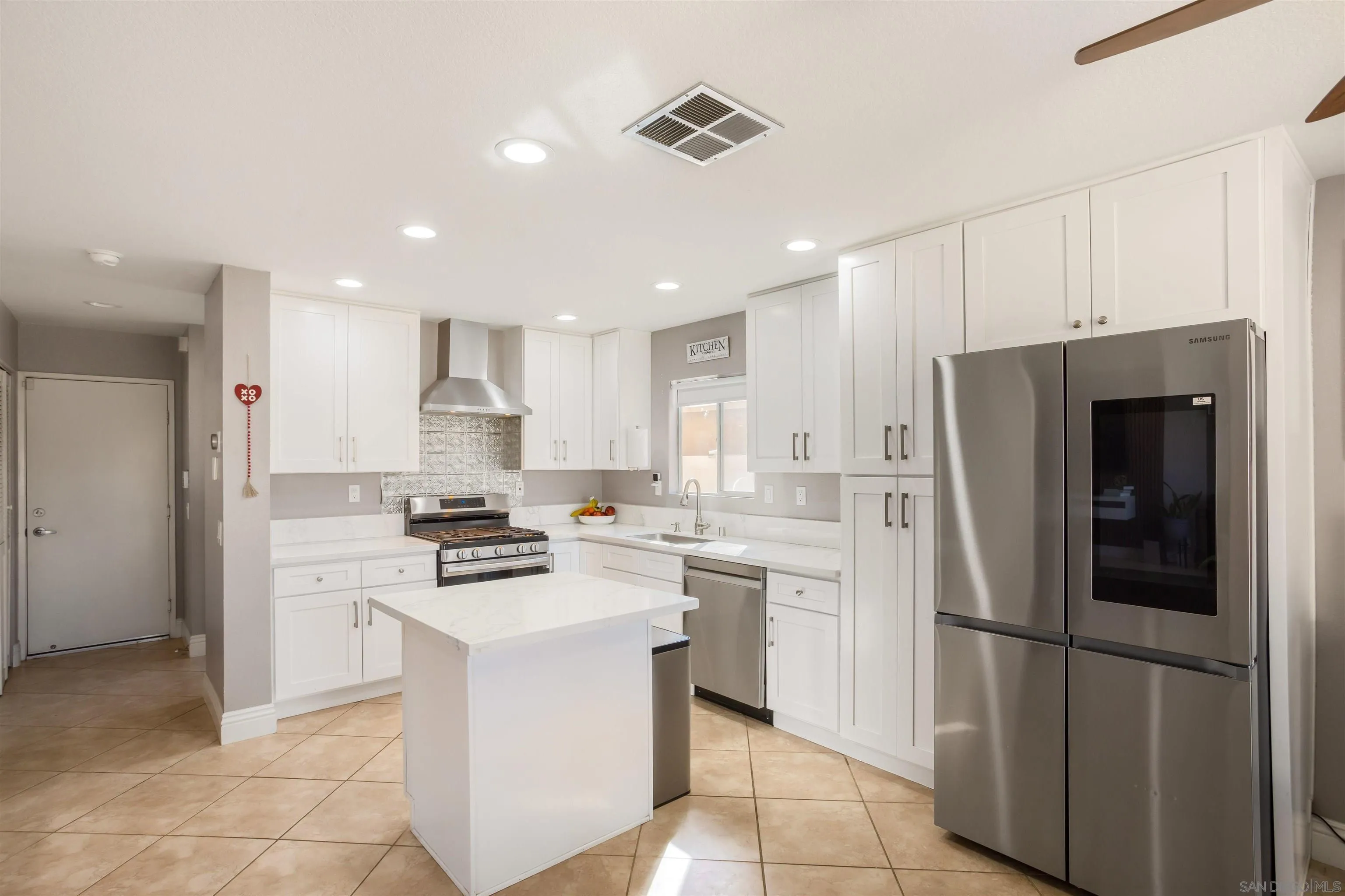 32812 Tulley Ranch Road Temecula, CA 92592 - Photo 4 of 27 a kitchen with a stove a refrigerator and a sink