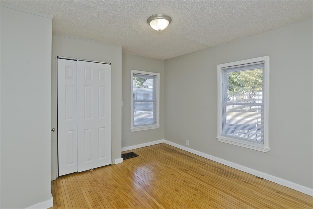 293 Eastern Avenue Springfield, MA 01109 - Photo 21 of 31 a view of empty room with wooden floor