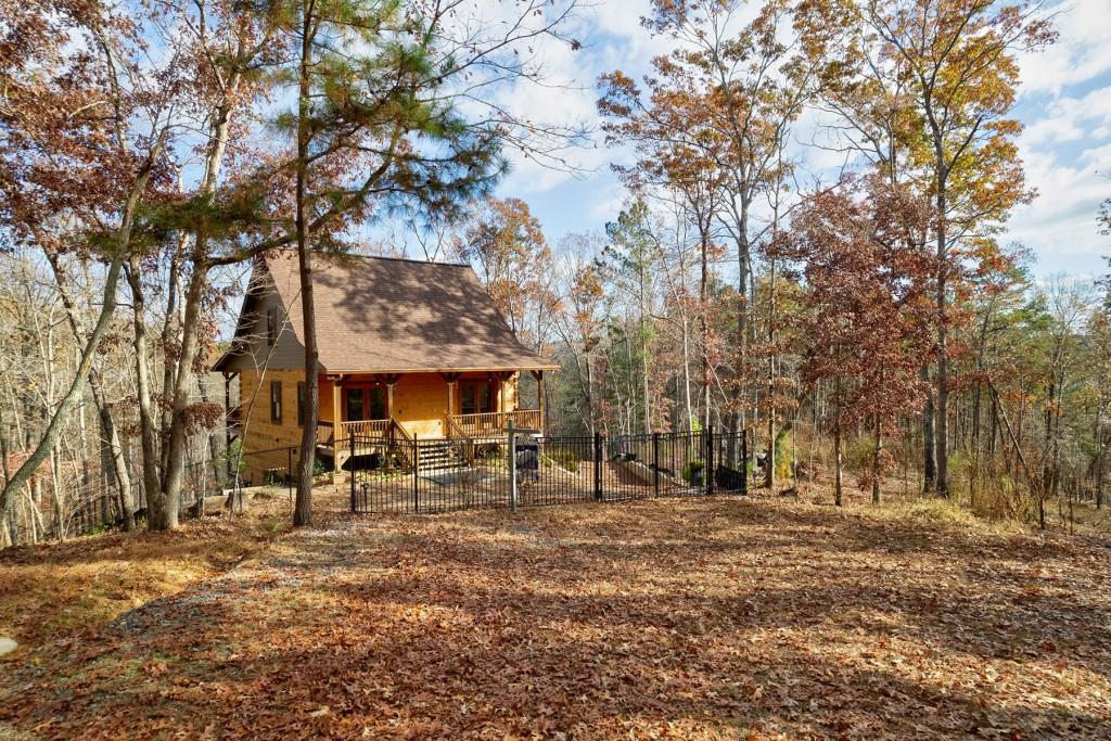 161 Turtle Ridge Road Ellijay, GA 30540 - Photo 1 of 1 a front view of a building with trees