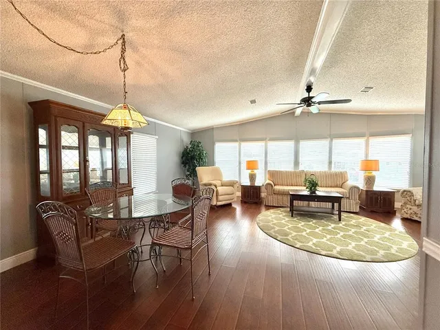 a living room with furniture a window and a table