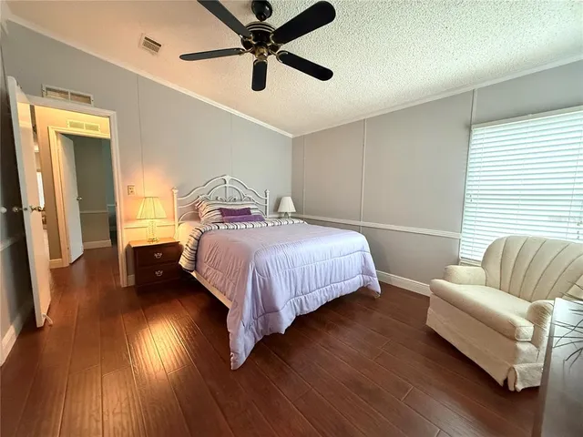 a bedroom with a bed and furniture