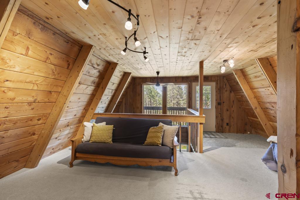 1201 Spruce Road Cimarron, CO 81220 - Photo 21 of 35 a living room with furniture and a window