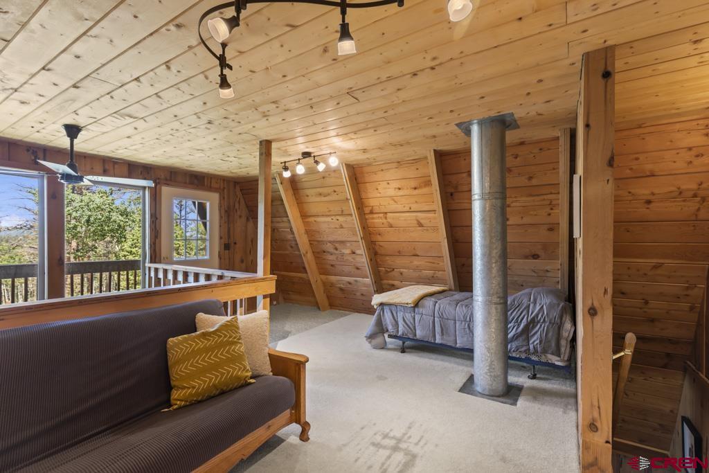 1201 Spruce Road Cimarron, CO 81220 - Photo 22 of 35 a living room with furniture and a flat screen tv
