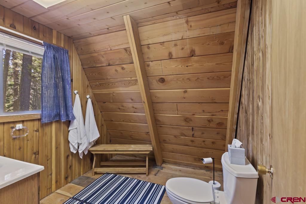 1201 Spruce Road Cimarron, CO 81220 - Photo 28 of 35 a bathroom with a toilet and a shower