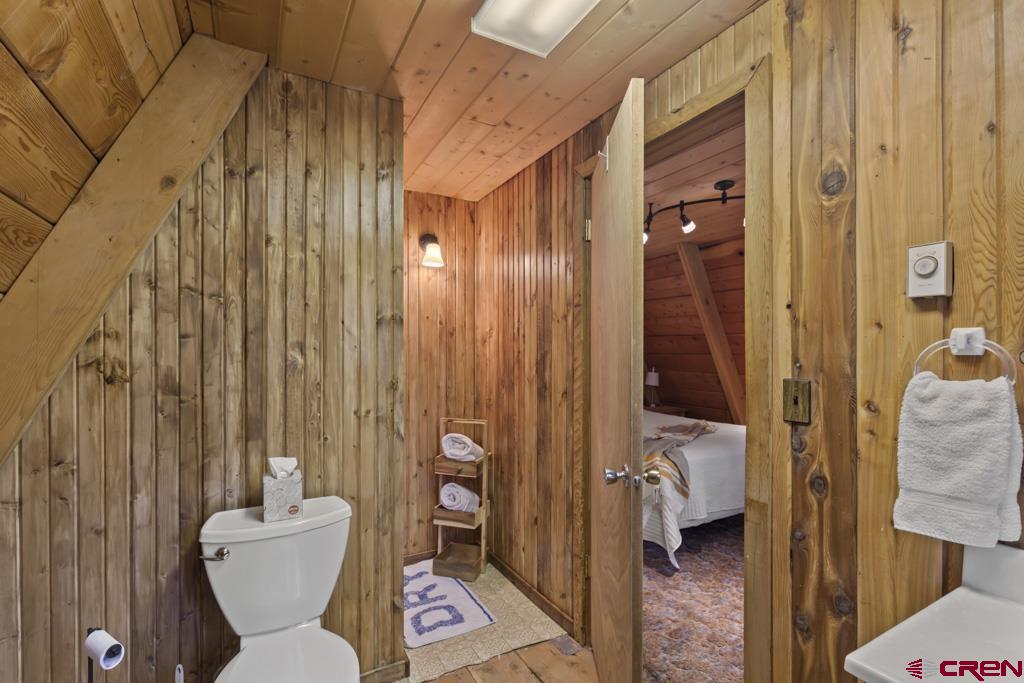 1201 Spruce Road Cimarron, CO 81220 - Photo 29 of 35 a bathroom with a toilet and a shower