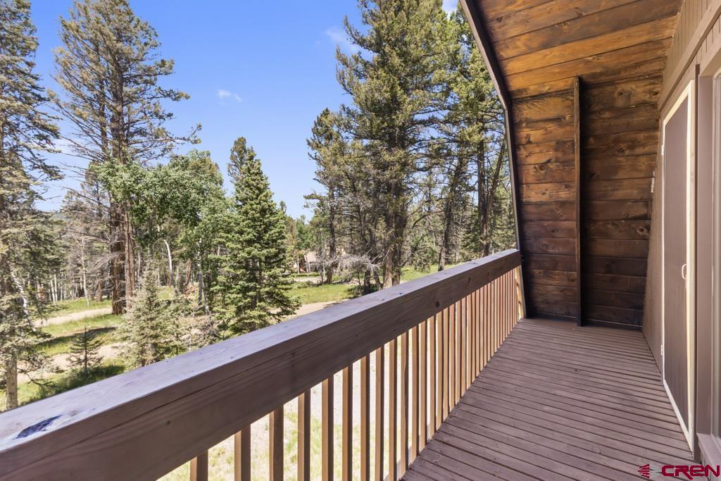 1201 Spruce Road Cimarron, CO 81220 - Photo 32 of 35 a view of a balcony with wooden fence