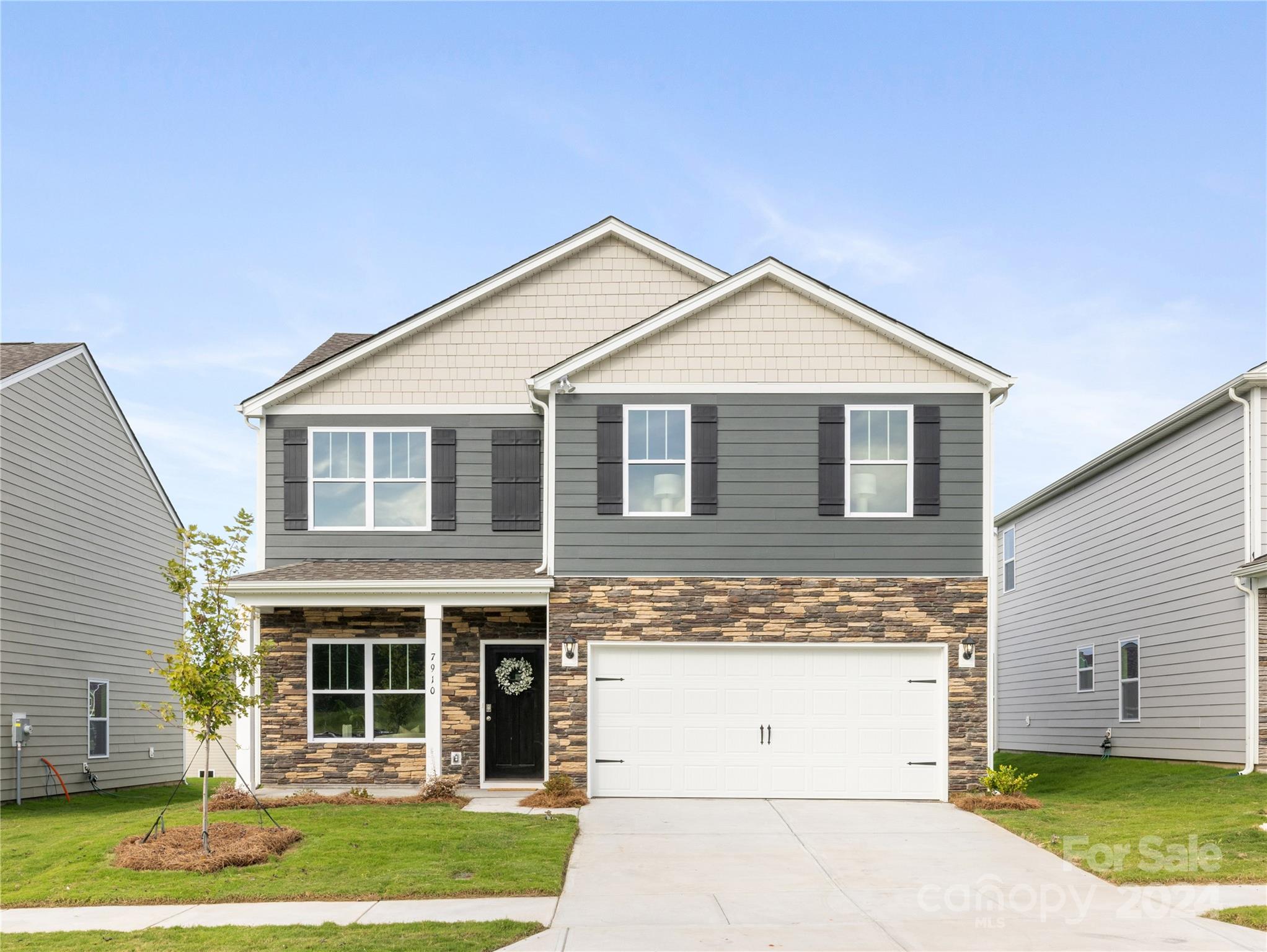 7910 Old Brk Road Sherrills Ford, NC 28673 - Photo 1 of 24 a front view of a house with a garden and trees