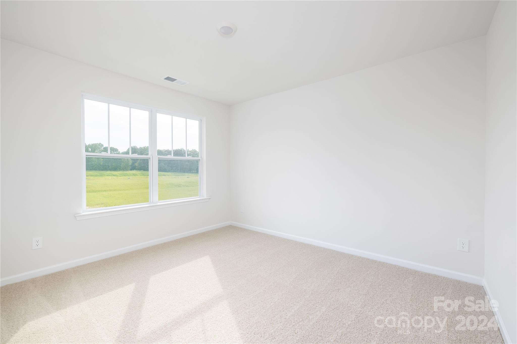 7910 Old Brk Road Sherrills Ford, NC 28673 - Photo 17 of 24 an empty room with a window