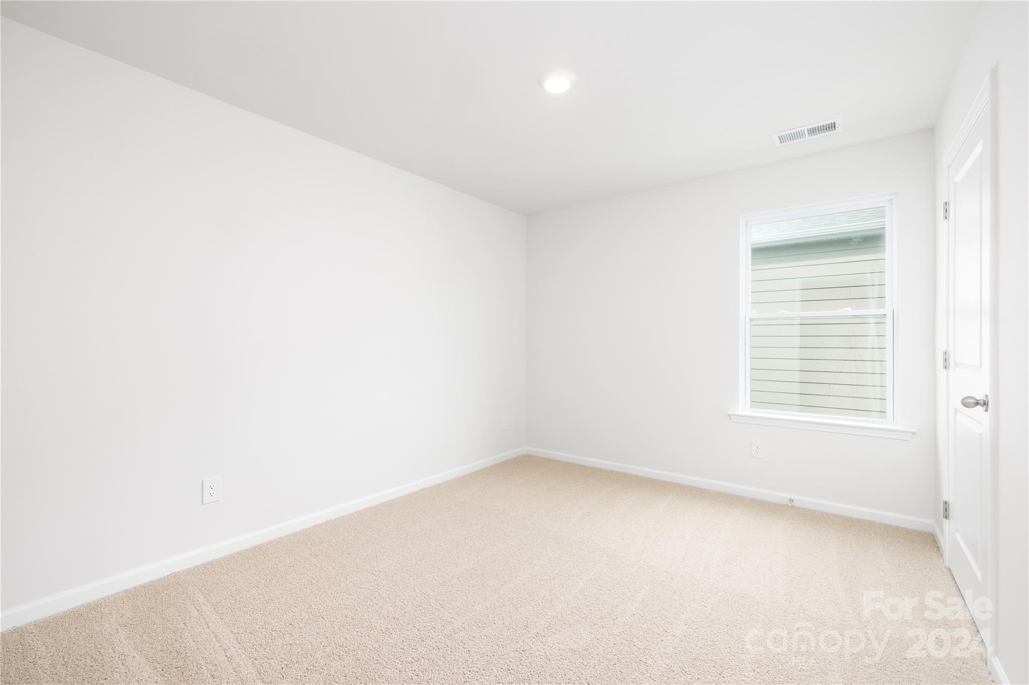 7910 Old Brk Road Sherrills Ford, NC 28673 - Photo 20 of 24 an empty room with a window