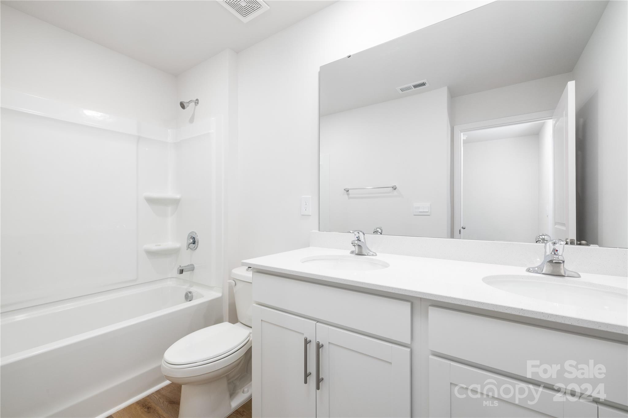 7910 Old Brk Road Sherrills Ford, NC 28673 - Photo 21 of 24 a bathroom with a sink toilet vanity granite tub and shower
