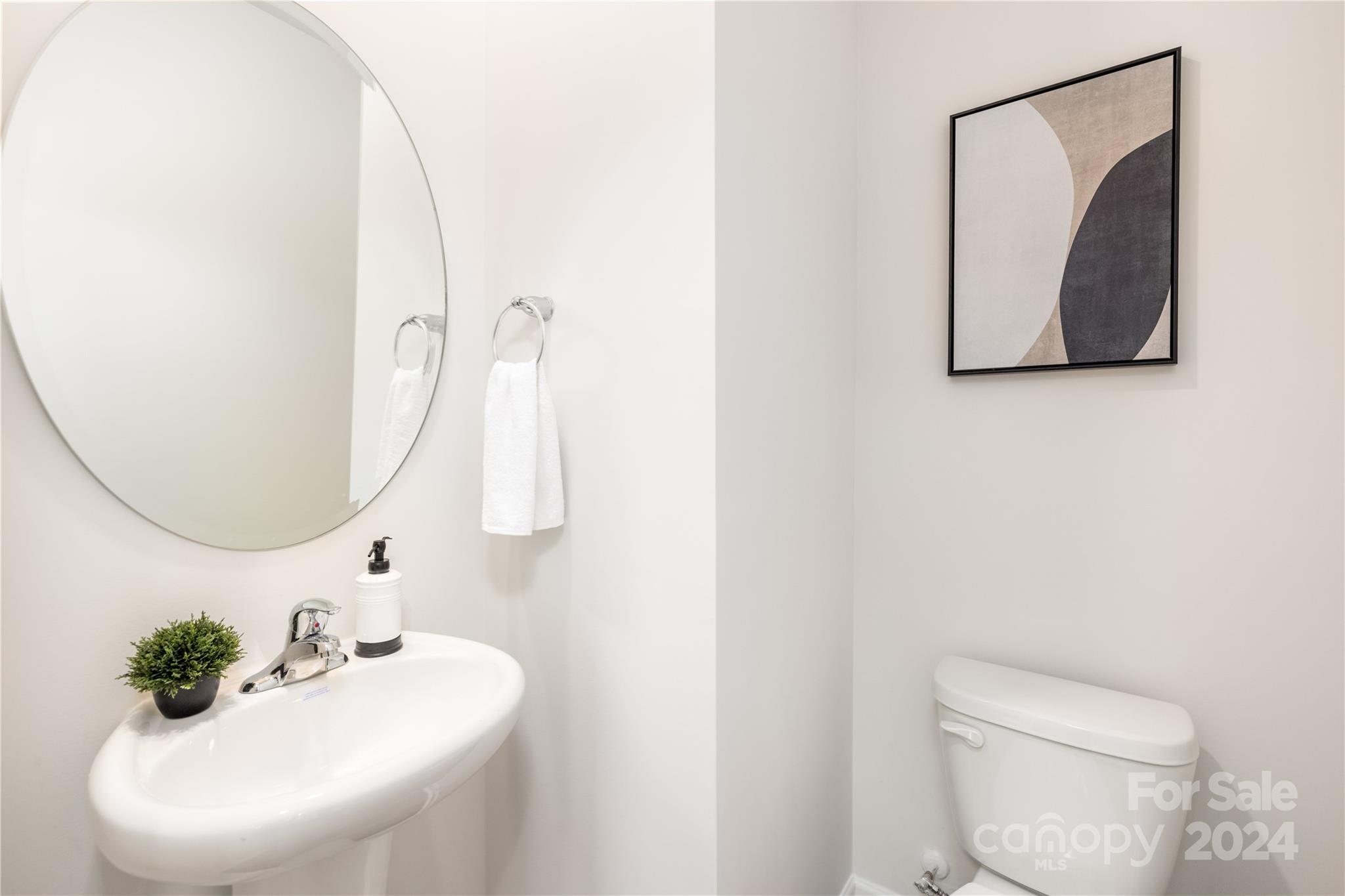 7910 Old Brk Road Sherrills Ford, NC 28673 - Photo 4 of 24 a bathroom with a sink mirror and toilet