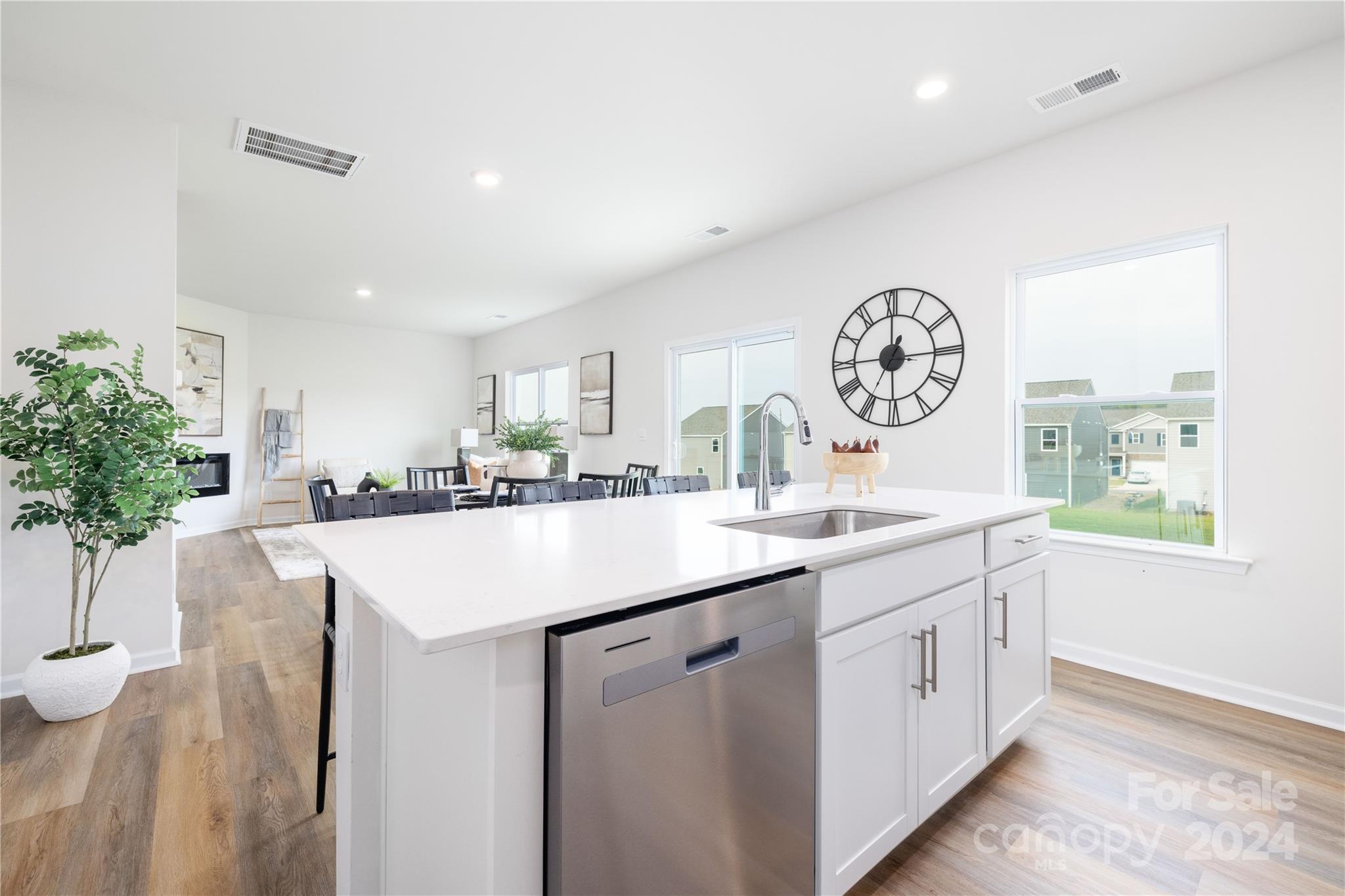 7910 Old Brk Road Sherrills Ford, NC 28673 - Photo 10 of 24 a kitchen with a sink and a clock on the wall