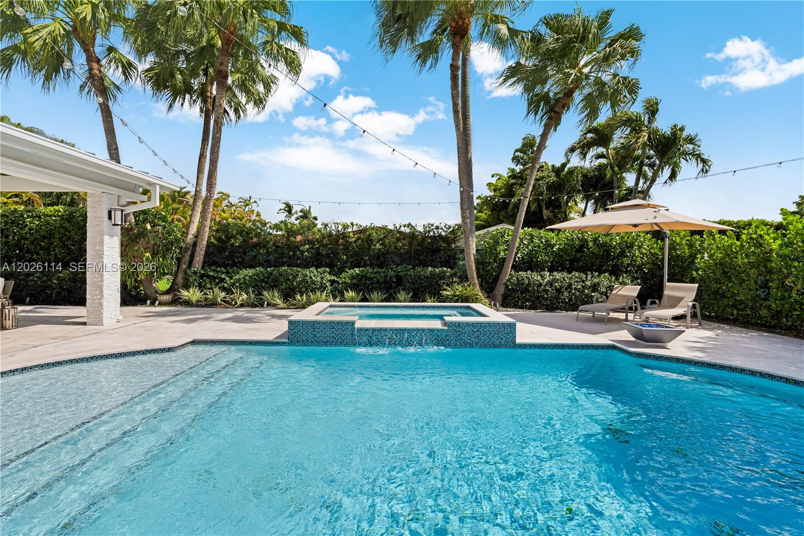 9641 Southwest 66th Street Miami, FL 33173 - Photo 42 of 57 a view of a swimming pool and lounge chair
