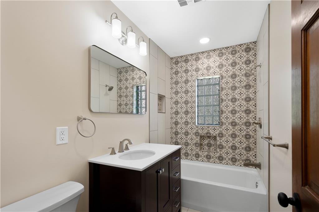330 Center Grange Road Monaca, PA 15061 - Photo 11 of 26 a bathroom with a bathtub sink mirror and toilet