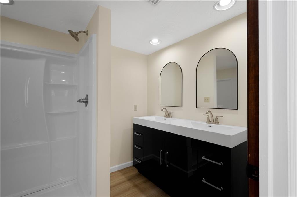 330 Center Grange Road Monaca, PA 15061 - Photo 19 of 26 a bathroom with a double vanity sink and mirror