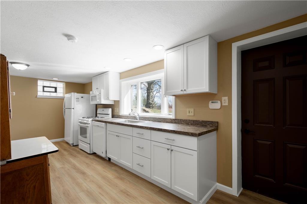 330 Center Grange Road Monaca, PA 15061 - Photo 20 of 26 a kitchen with white cabinets and sink